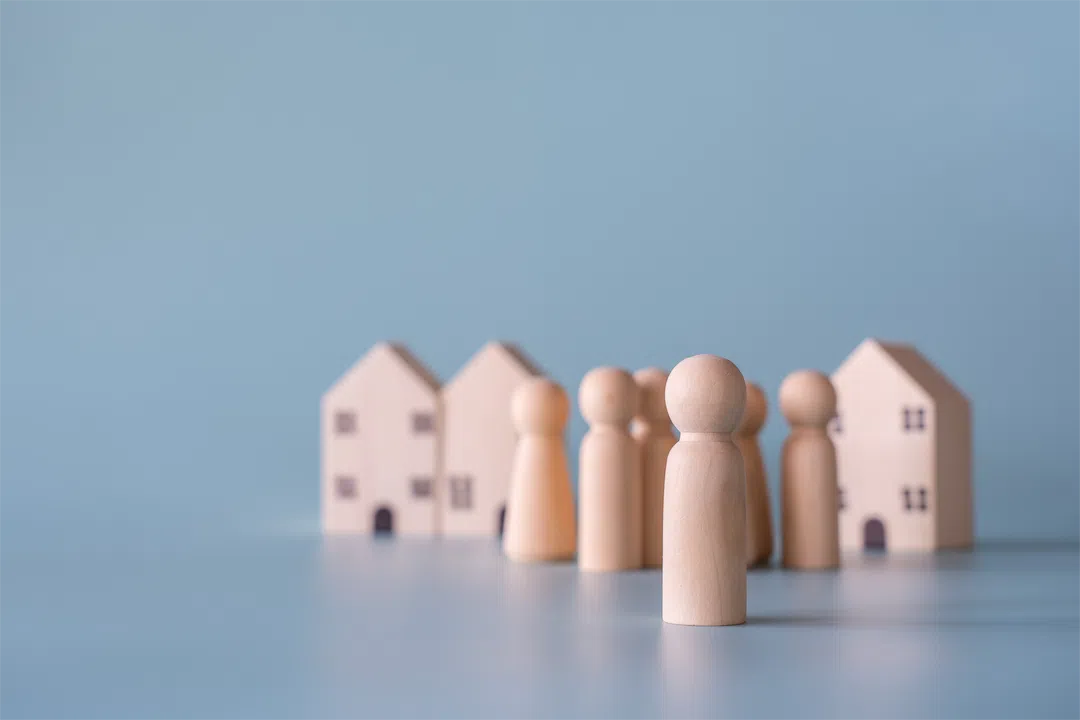 Small wooden figures representing a family, underscoring the importance of complying with Fair Housing laws.